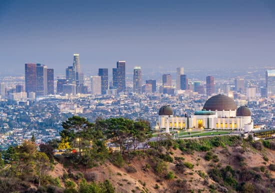 Bodyguard Services in Los Angeles. Los Angeles at dusk with the Griffith Observatory and downtown skyline illuminated.