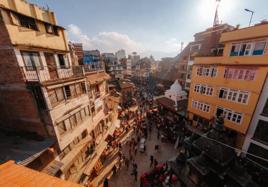 Bodyguard Services in Morocco. A bustling street in Kathmandu, Nepal, with colorful buildings and crowds of people.