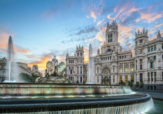 Bodyguard services in Madrid. A beautiful fountain with the Cybele Palace in the background at sunset in Madrid, Spain