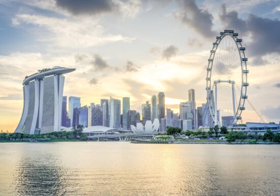 Body guard services in Singapore. Singapore skyline with the Marina Bay Sands hotel and Singapore Flyer at sunset.