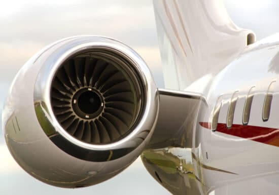 Corporate Travel Safety. Close-up view of a private jet engine turbine.